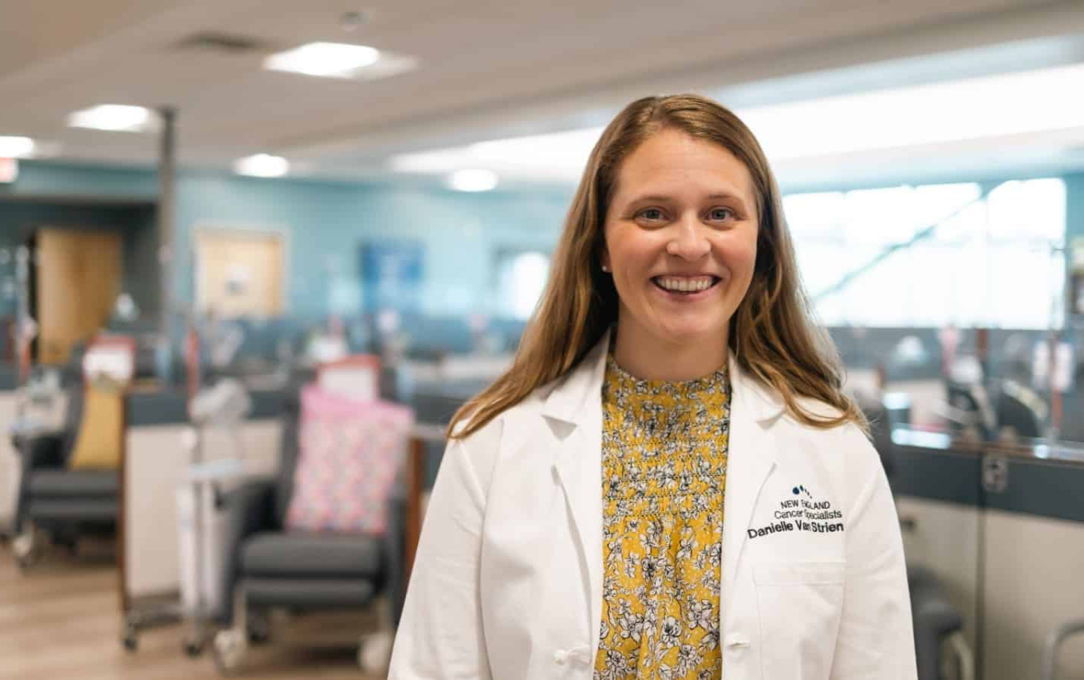 Physicians Assistant smiling in treatment room